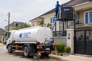Water tanker delivering to a residential overhead tank in a Lagos estate